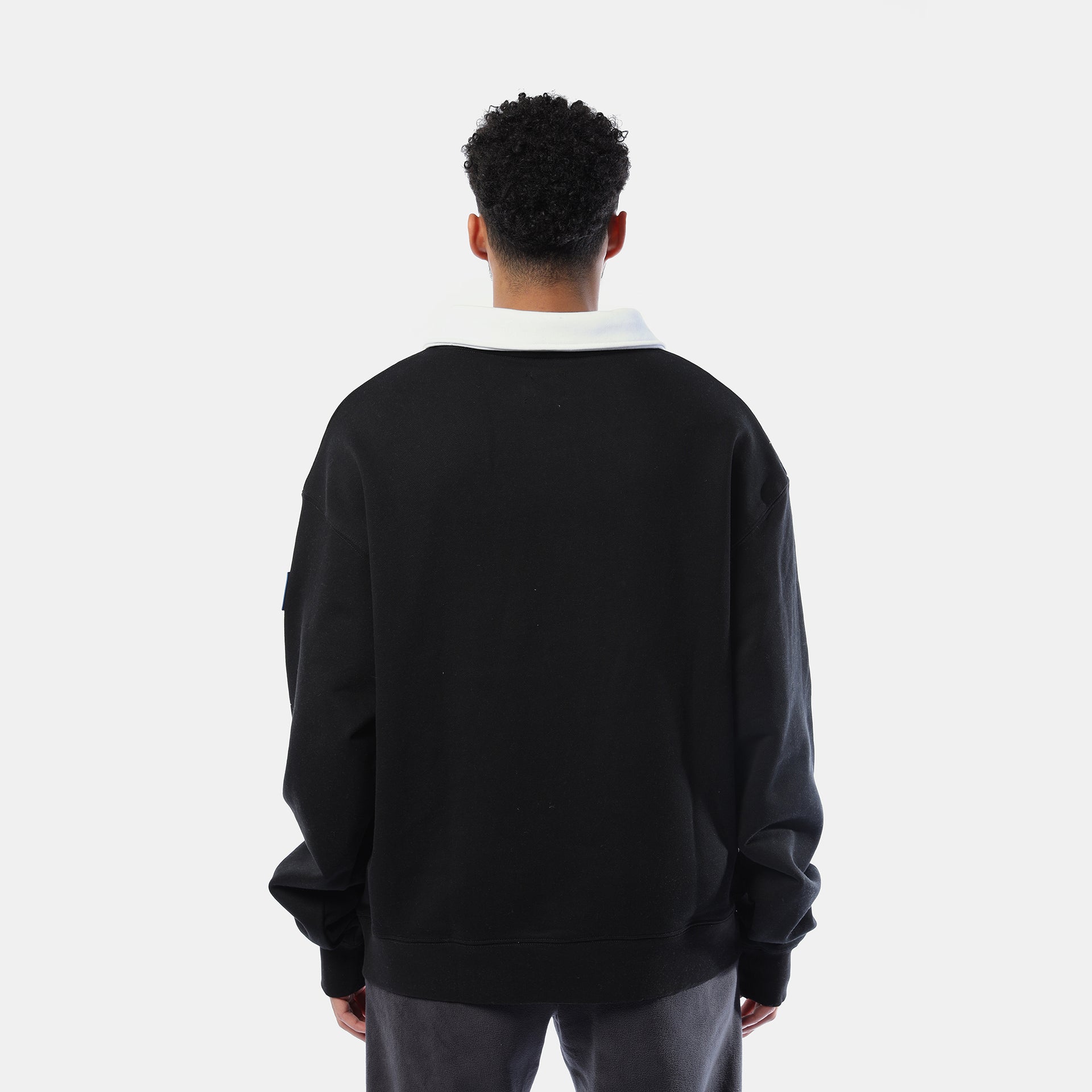 White collar black sweater