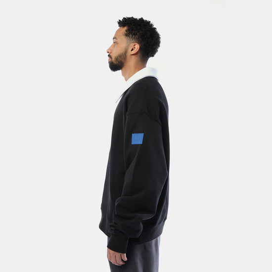 White collar black sweater